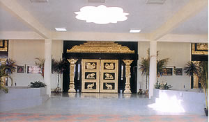Gracefully designed brass cladded glass doors in the entrance